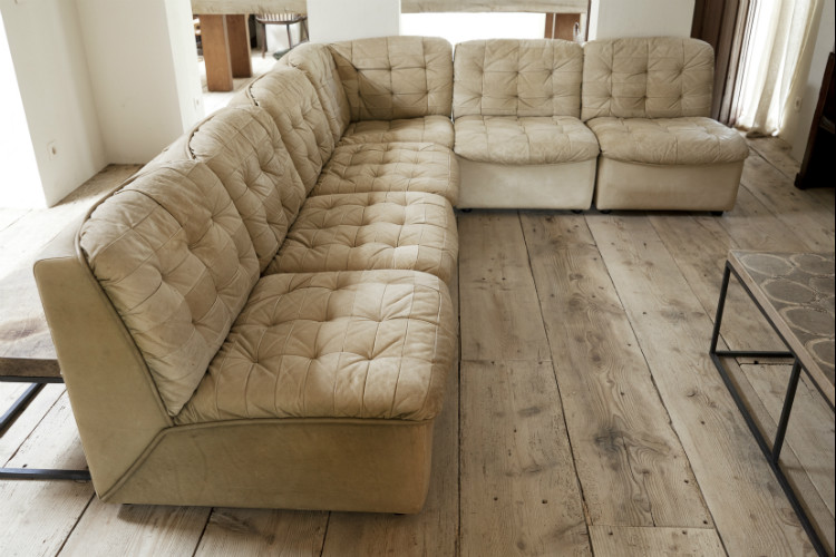 ivory colored leather sectional canapé