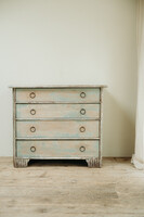 cedarwood/hazlenut twig chest of drawers .. rests of blue paint ..