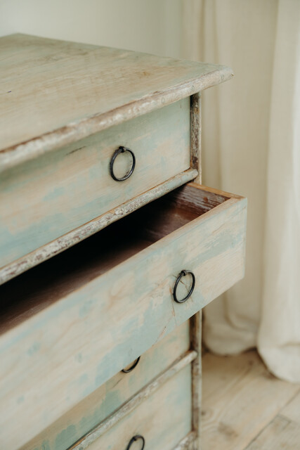 cedarwood/hazlenut twig chest of drawers .. rests of blue paint ..