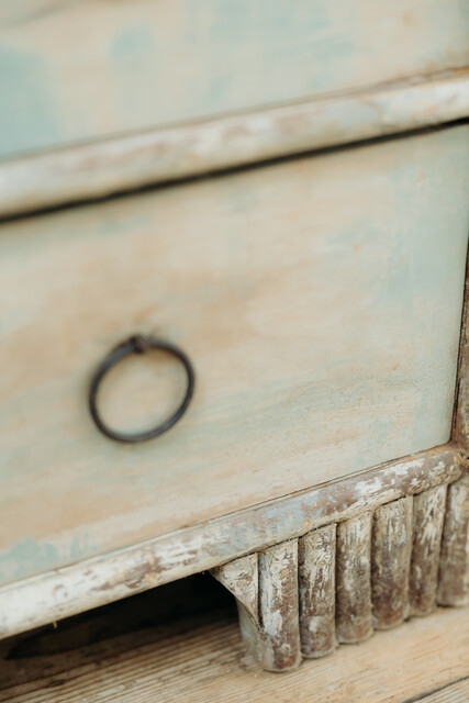 cedarwood/hazlenut twig chest of drawers .. rests of blue paint ..