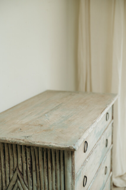 cedarwood/hazlenut twig chest of drawers .. rests of blue paint ..