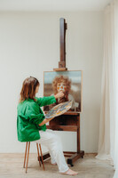 in front of the easel ...