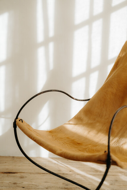 occasional iron chair .. upholstered with cowskin ...