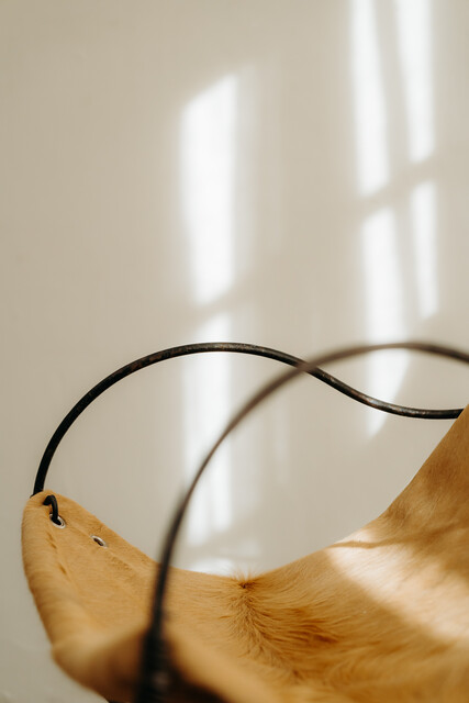 occasional iron chair .. upholstered with cowskin ...