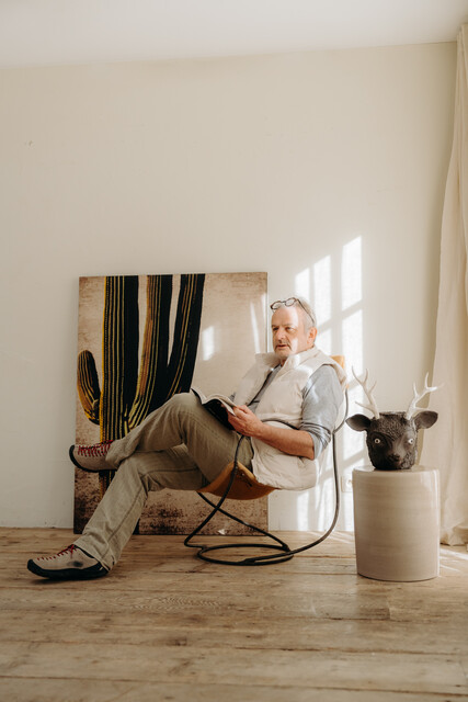 occasional iron chair .. upholstered with cowskin ...