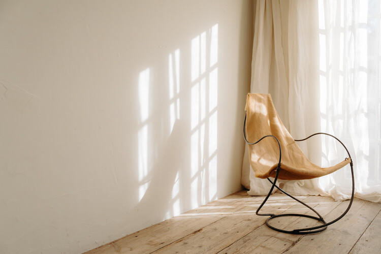 occasional iron chair .. upholstered with cowskin ...