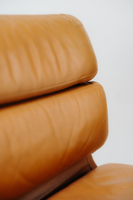 pair of cognac colored Eames chairs ...