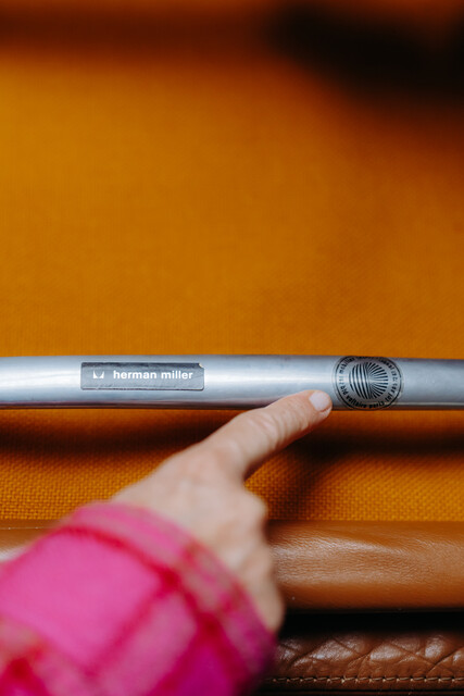 pair of cognac colored Eames chairs ...