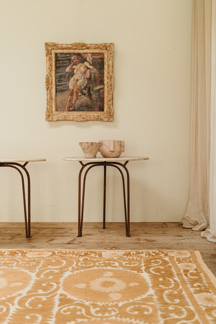 pair of marbletopped iron tables ... 