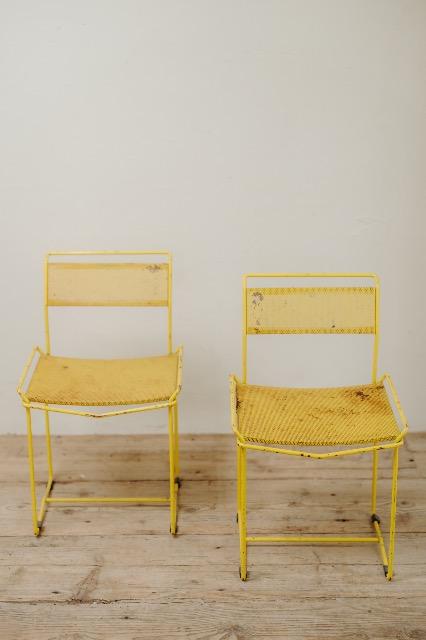pair of yellow metal chairs .. 