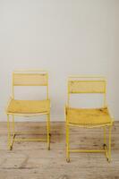 pair of yellow metal chairs .. 