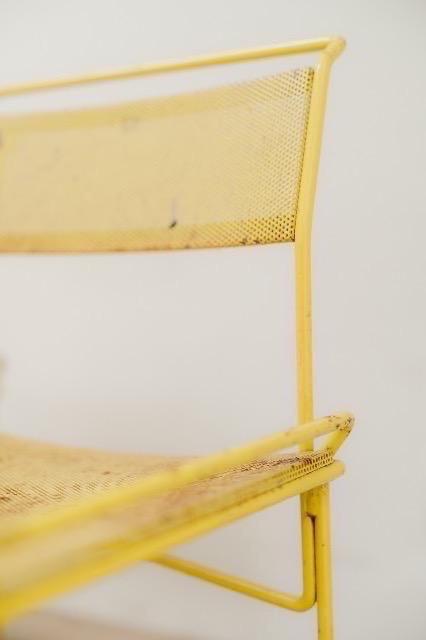 pair of yellow metal chairs .. 