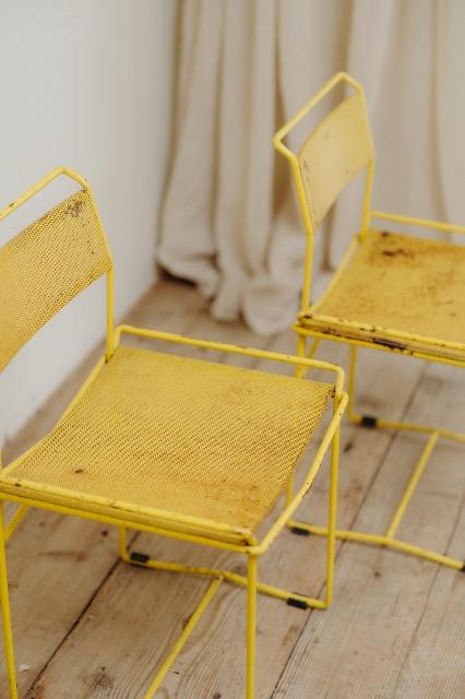 pair of yellow metal chairs .. 