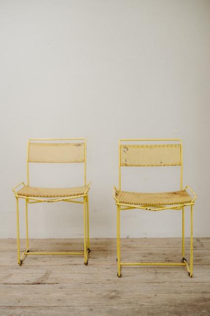 pair of yellow metal chairs .. 