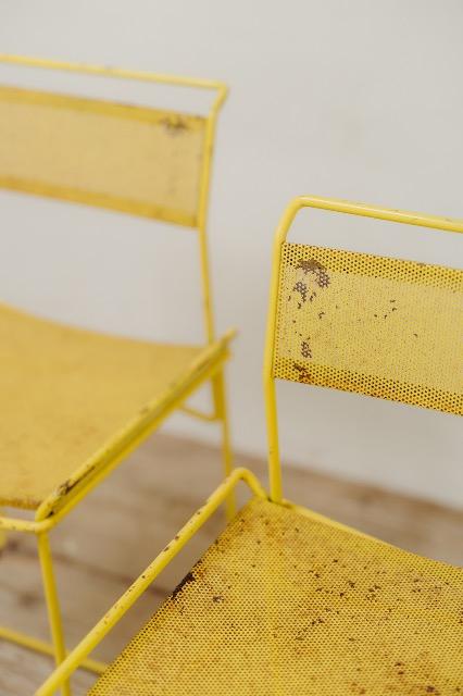 pair of yellow metal chairs .. 