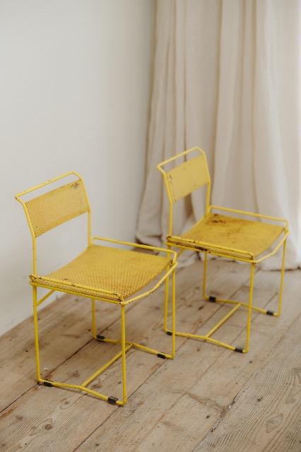 pair of yellow metal chairs .. 