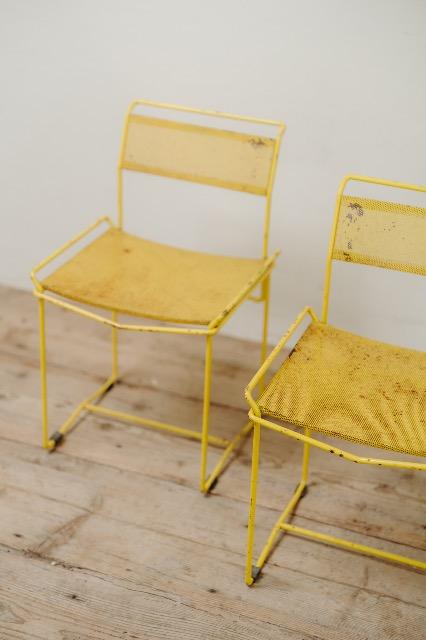 pair of yellow metal chairs .. 