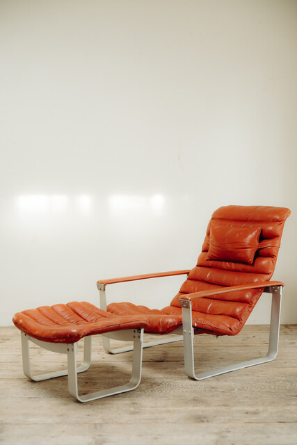 red leather lounge chair and ottoman by Ilmari Lappalainen ..