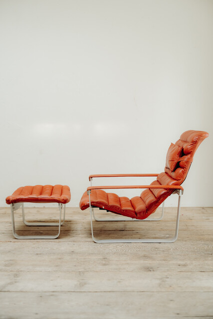 red leather lounge chair and ottoman by Ilmari Lappalainen ..