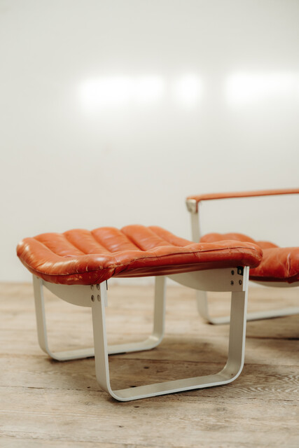 red leather lounge chair and ottoman by Ilmari Lappalainen ..